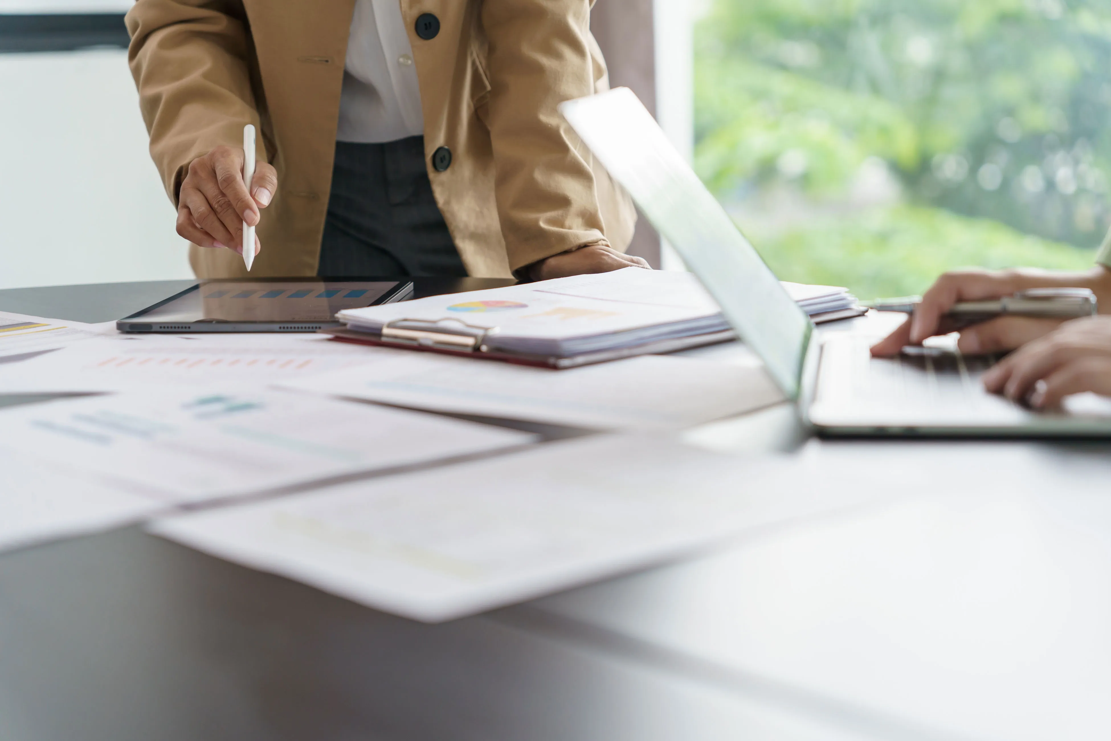 People reviewing charts as a capital pool’s role is named before allocation.