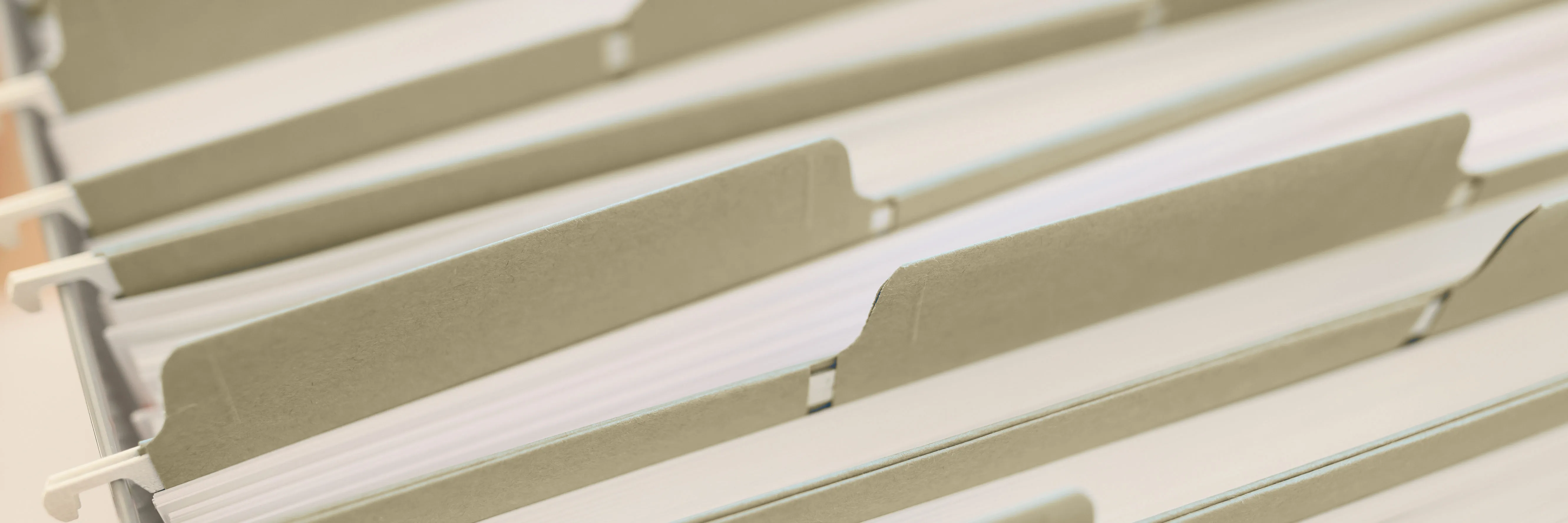 File folders arranged to suggest defining a capital pool’s role before exposure decisions.