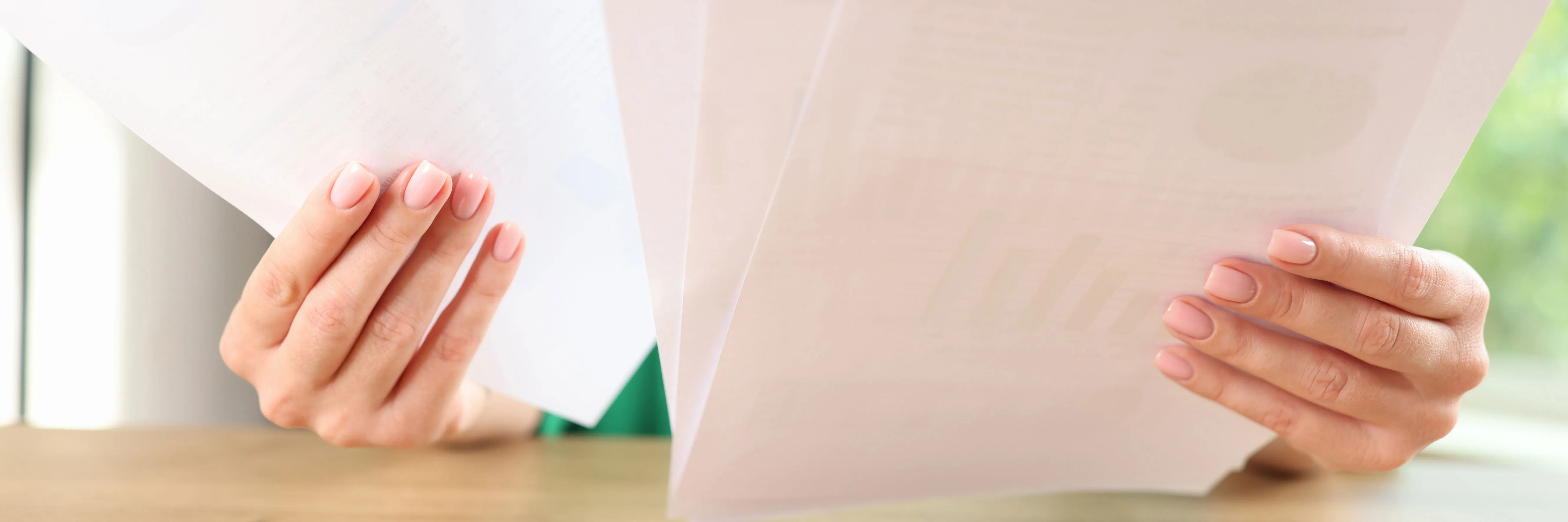 Hands reviewing documents for capital roles tested when markets move sharply.